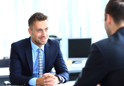 Happy business people talking on meeting at office